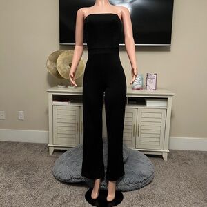 “At your best” black jumpsuit.  Great Fit & Stretch.  Size US 6 New!